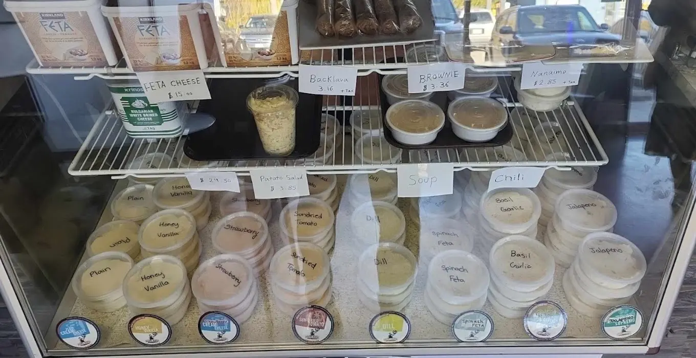 Tubs of house-made cream cheese in the deli case