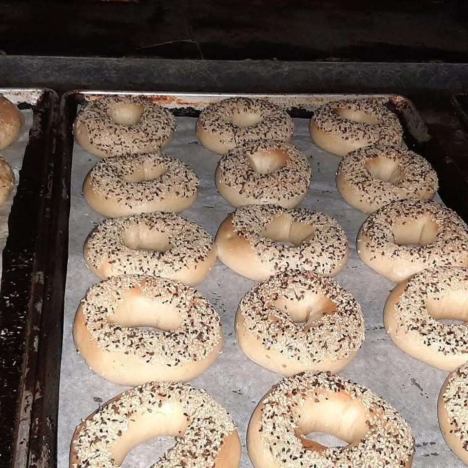 Trays of fresh bagels in the bakery